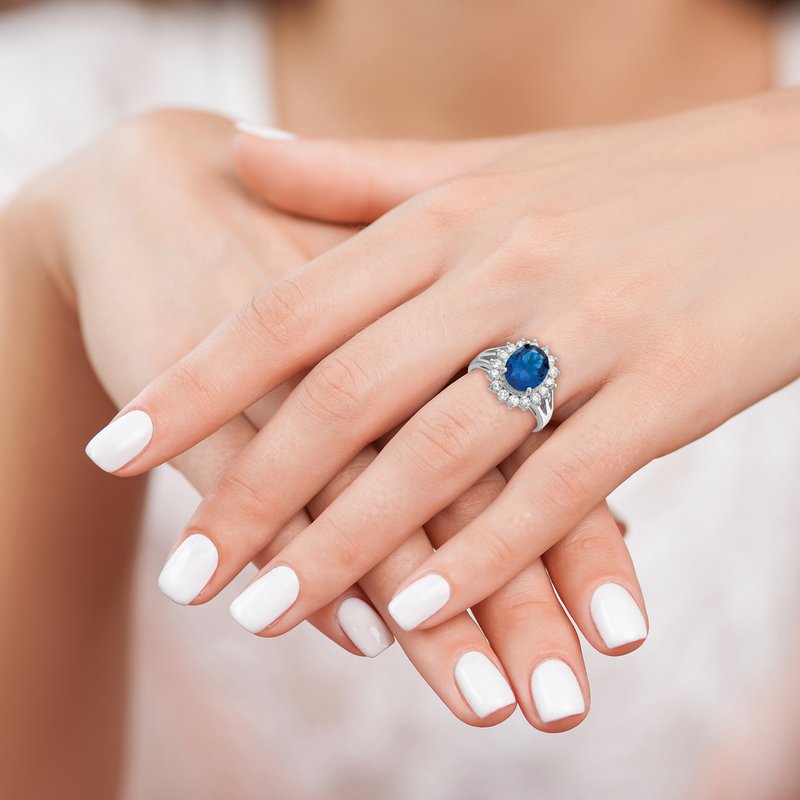 Sterling Silver Rhodium-plated Brilliant-cut Lab Created Dark Blue Spinel and Brilliant-cut White CZ Oval Halo Ring